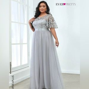 A gown for prom/weddings in silver with flutter sleeves